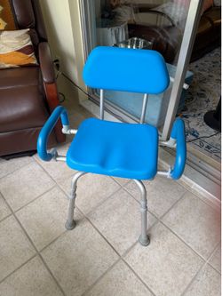 Padded shower chair that swivels.