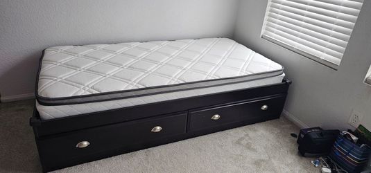 Twin bed frame with drawers and mattress