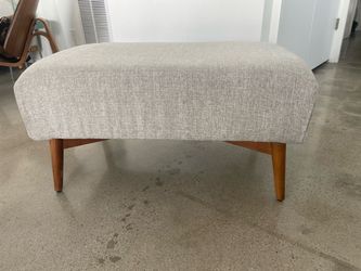 Light Gray Upholstered Ottoman with Wood Legs