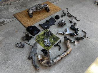 Stack of Subaru OEM spares WRX EJ205 USDM and JDM