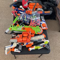 Lot Of Nerf Guns With Darts And A Bunch Of Attachments 