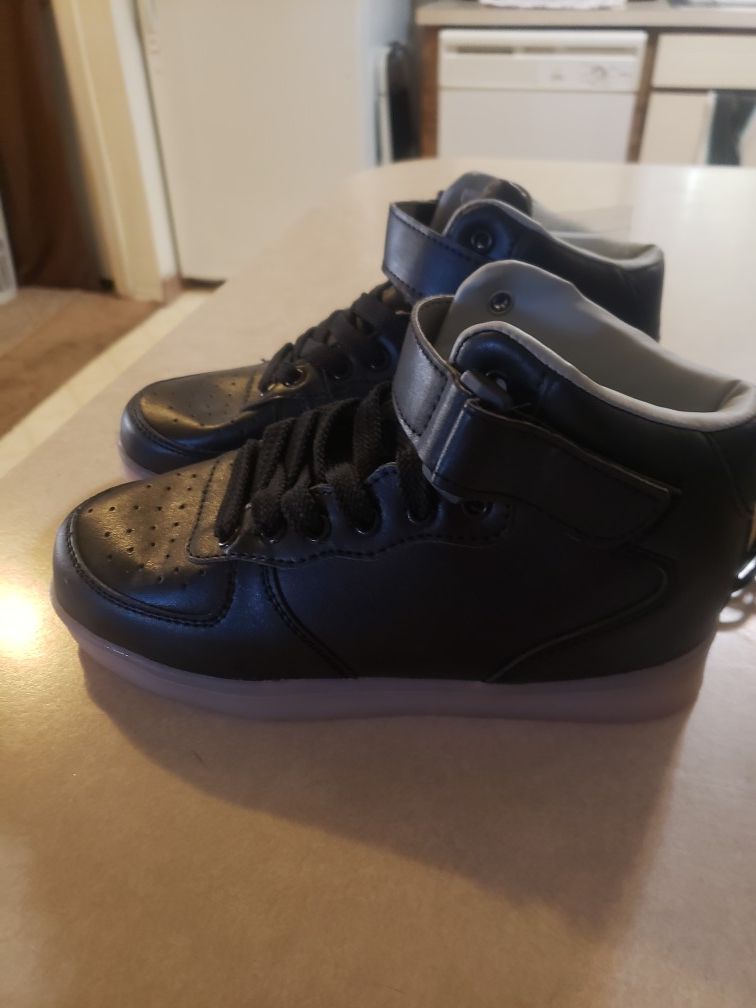 Size 4 boys light up shoes with charger BRAND NEW. MAKES A PERFECT XMAS GIFT