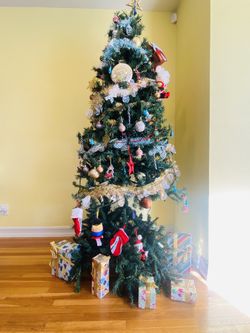 Used fake Christmas tree 7” with sturdy stand ( broken branches) Decorationn and ornaments NOT included