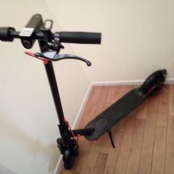 Two-wheel Front Wheel Scooter Asking $100 Firm Comes With Battery Charger Works Great Use Like New