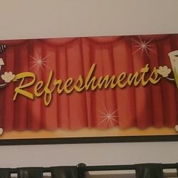 retro-style movie snack signs designed as wall art, perfect for a home theater, media room, or game room. They feature cartoon designs of classic conc