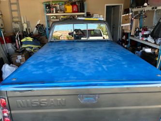 Fiberglass bed top cover trade for a camper