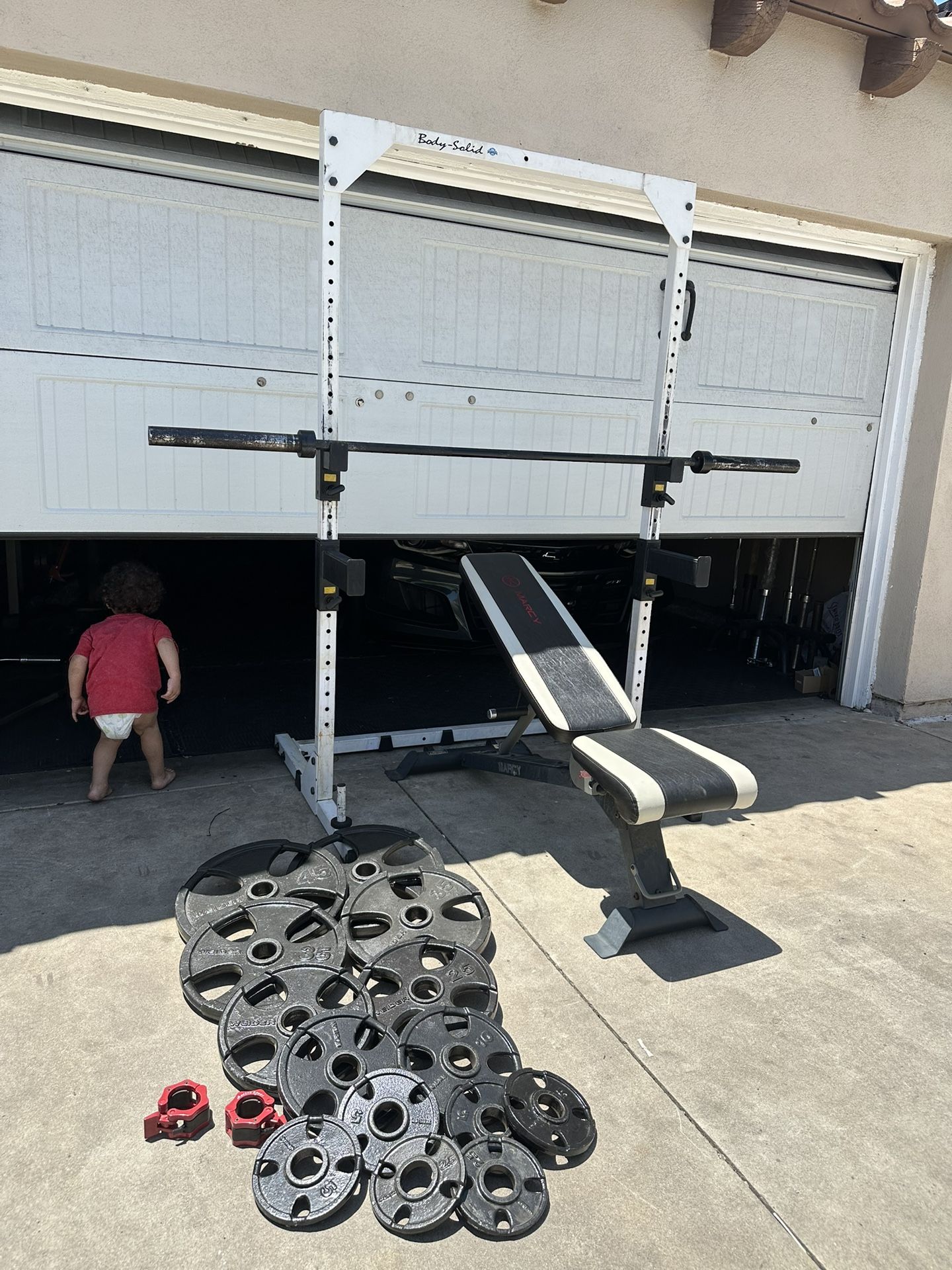 Bench press/squat rack with 7ft bar plus 255lbs of Olympic weights