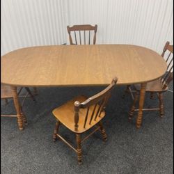 Large Table With Two Leafs And Four Chairs 