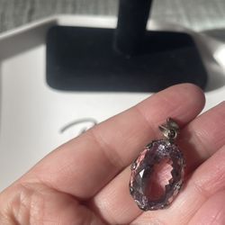 A silver faceted pink amethyst pendant. 