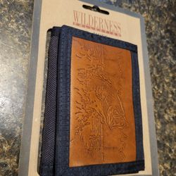 Wilderness wallet fish etched on front, navy colored nylon wallet, new with tags