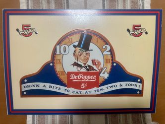 Retro Dr Pepper advertisement sign featuring classic design.