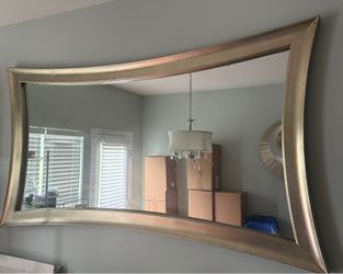 Large curved champagne wall mirror
