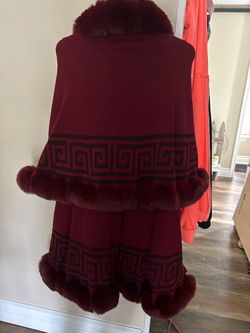Plush faux fur trimmed cape in deep wine