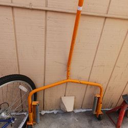 Two wheel dollies one wheel bearingsmithing but easy to fix and one tire carrier and one jack lift