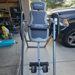 Used once- Innova Inversion Table with Adjustable Headrest, Reversible Ankle Holders, and 300 lb Weight Capacity.  Paid $135