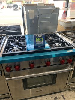 Wolf 36” slide in range with middle grill in stainless steel all gas