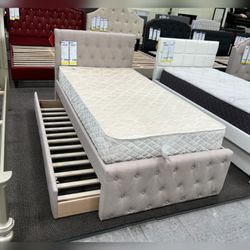 Light brown twin  bed frame with twin trundle