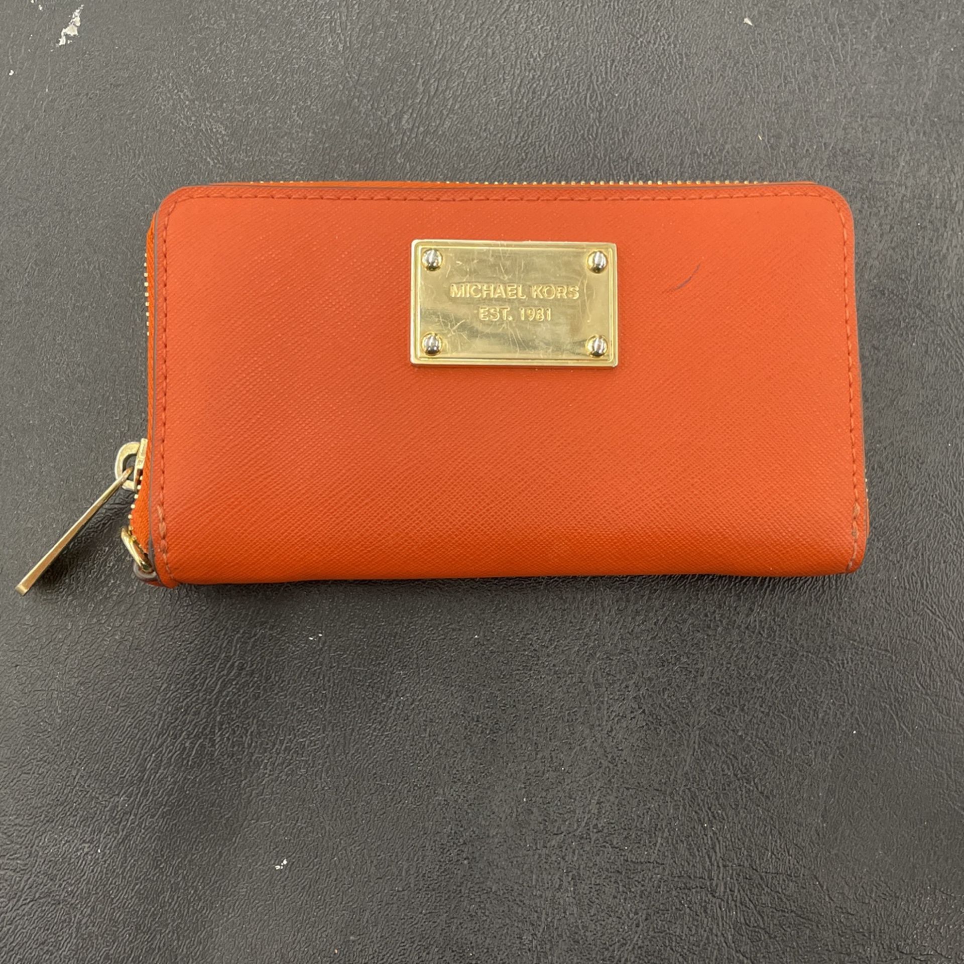 Michael Kors Orange Wallet. Item No 124 (Shopgoodwill)