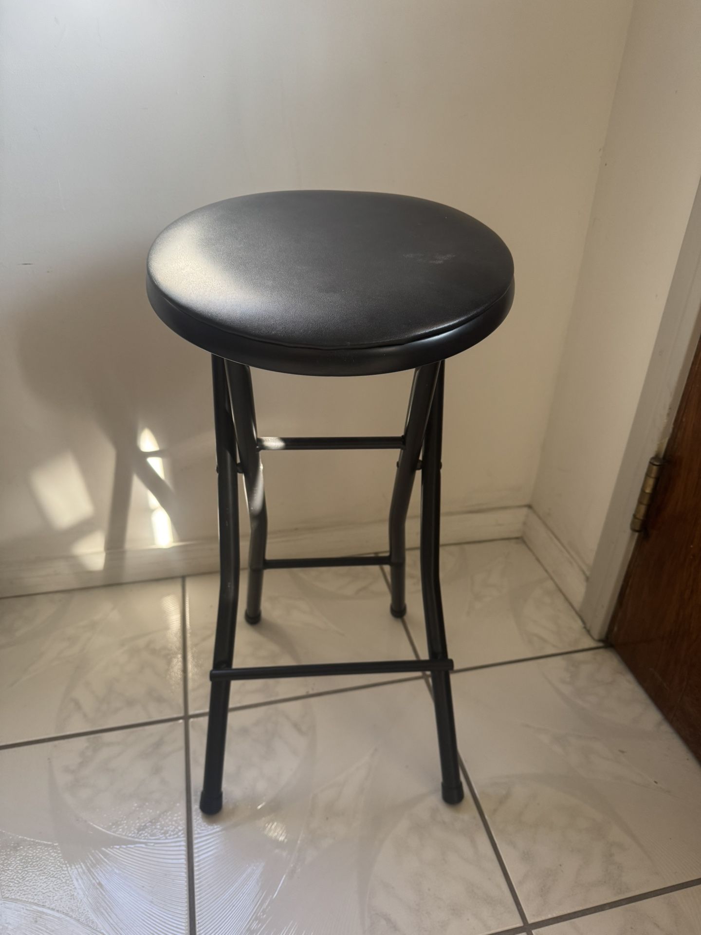 Black folding stool