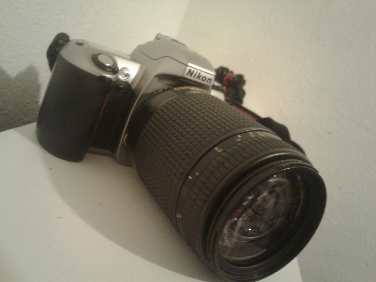 Nikon camera, F65 , with lenses , a bag ,and a instuctions manual.Not a digital camera.
