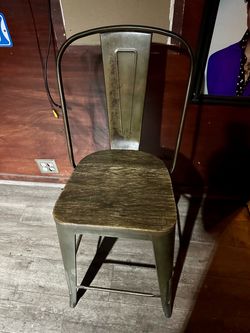 Rustic metal chair with wooden seat