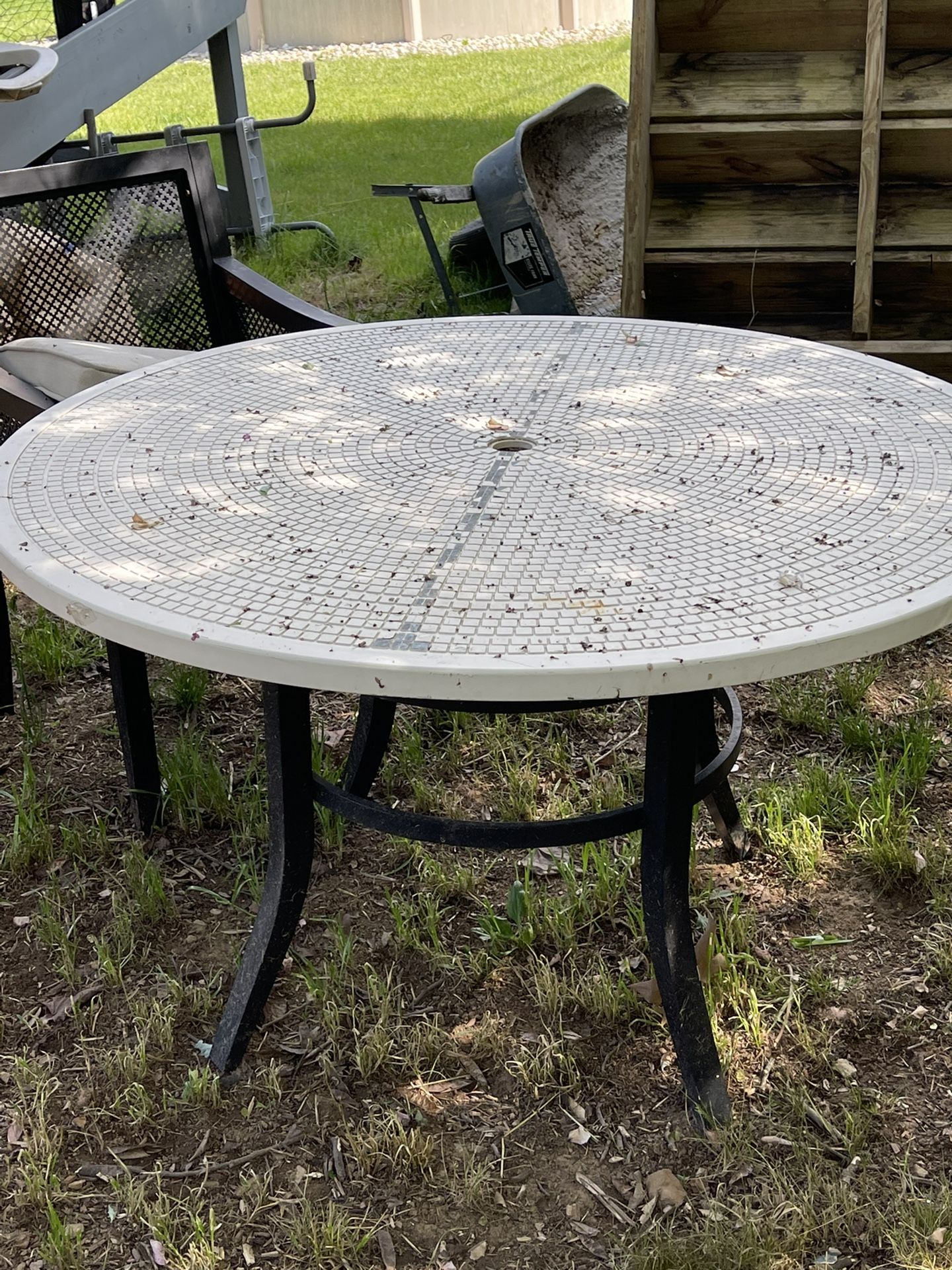 Outdoor table with umbrella opening 