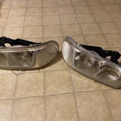 (2) - 2006 Yukon Housing Headlights 