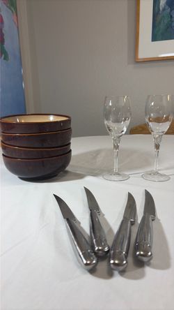 4 bowls, 2 wine glasses and 4 knifes