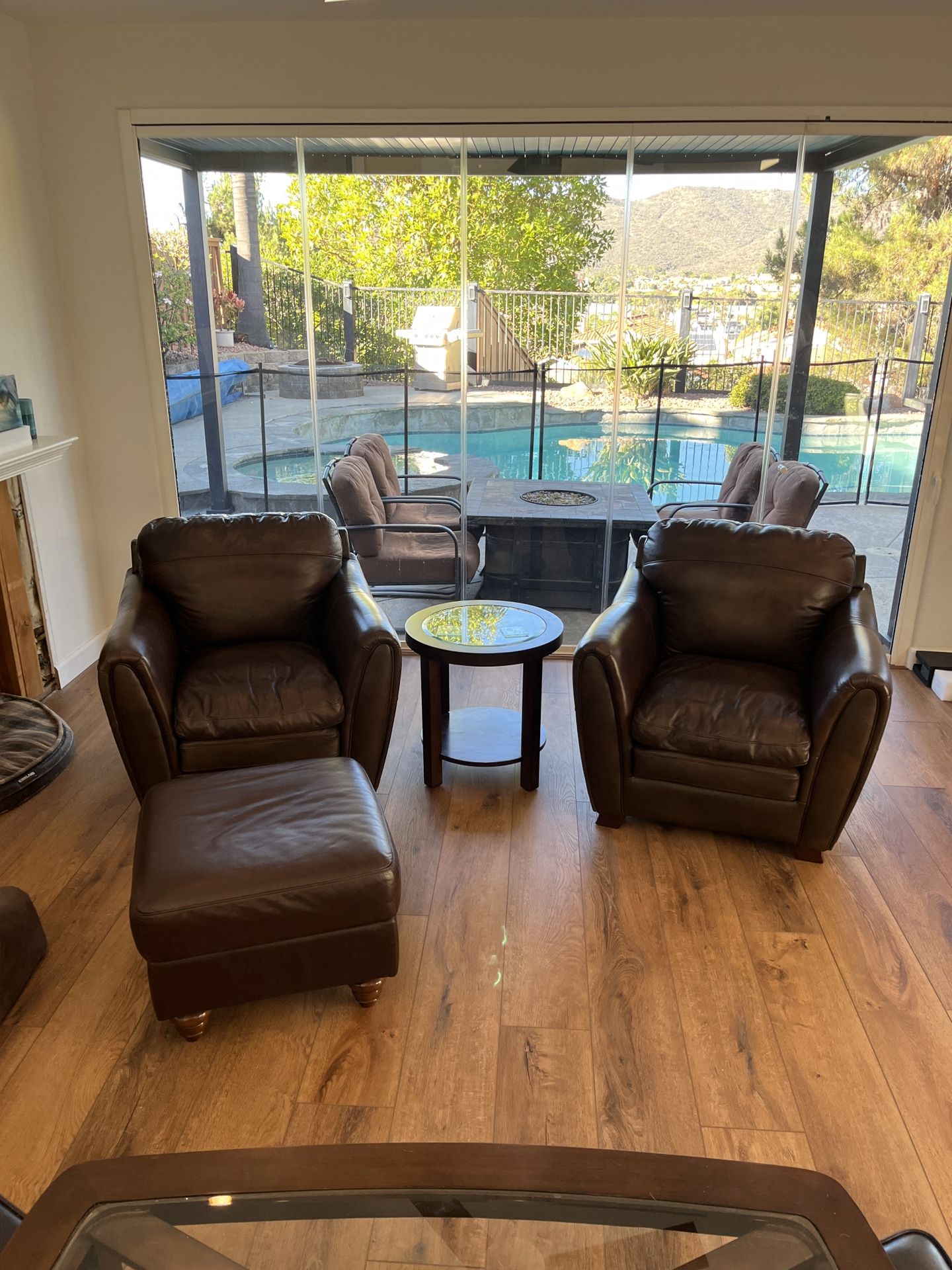Two Leather Armchairs and Ottoman