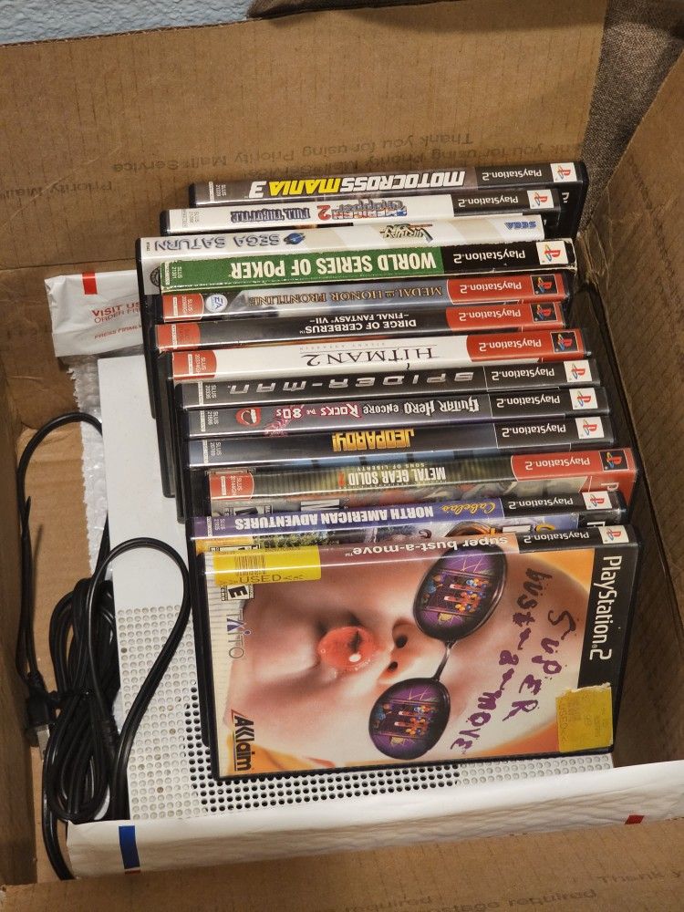 Box of PS2 Games And A Xbox One S Console