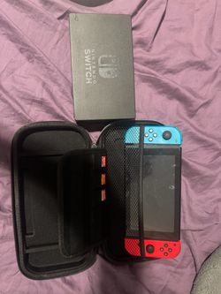 Nintendo Switch with games, case, and dock