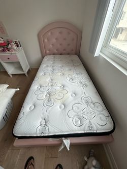 Pink Twin bed frame and mattress