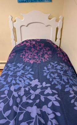 Refurbished antique twin bed frame with custom box spring and mattress