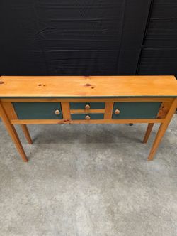Rustic Wood Console Table with Dark Green Cabinetry