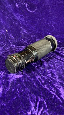 Lens Canon 100 x 300 lens comes with hood and filter