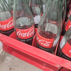 Full crate of old coke bottles