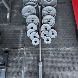 Olympic weights 255lbs total plus 7ft 45lbs bar