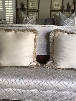 Beautiful beige toned down feather pillows.