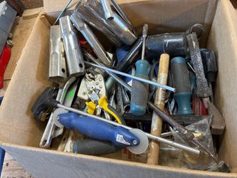 Box of misc hand tools like screw drivers hamper
