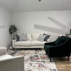 White Couch And Green Accent Chair
