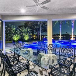 Glass Patio Dining Table with 8 High-End Solid-Cast-Aluminum Chairs 