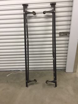 Metal bed frame adjustable for twin or full sizes bed