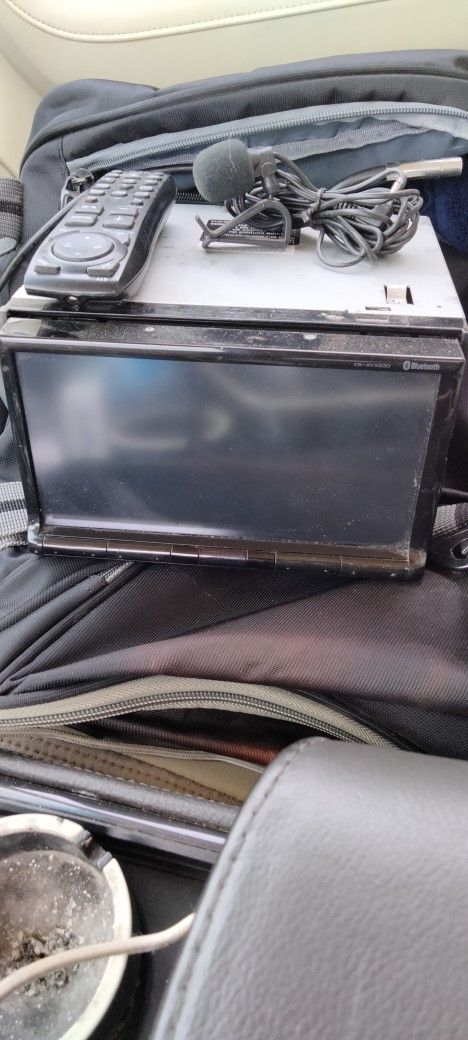 JVC In-dash CD/DVD player......7 Inch Touchscreen, Motion Sensor buttons at the bottom, bluetooth, remote control. All Wires And Harness Still Inta