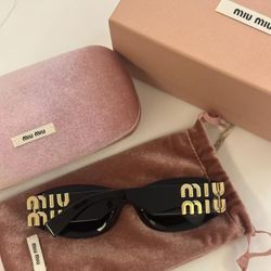 Miu Miu Women's Black and Gold Sunglasses