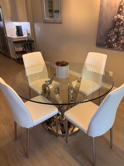 Glass and silver table and 4 chairs