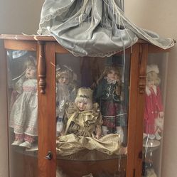 Curio  cabinet And Beautiful Porcelain Collectable Dolls 