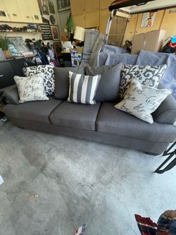 Modern living room sofa  complete with end tables and coffee table