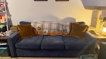 Light dusty blue three person couch