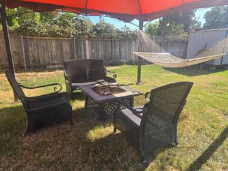 Outdoor patio set with fire pit.