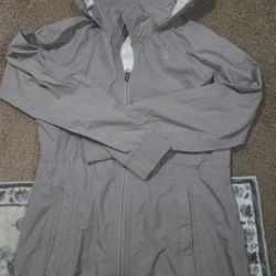 Like New. Size small. Grey color. The North Face Womens 

Rain coat with waterproof lining. Two pockets, adjustable drawstring waist, stretch cuffing